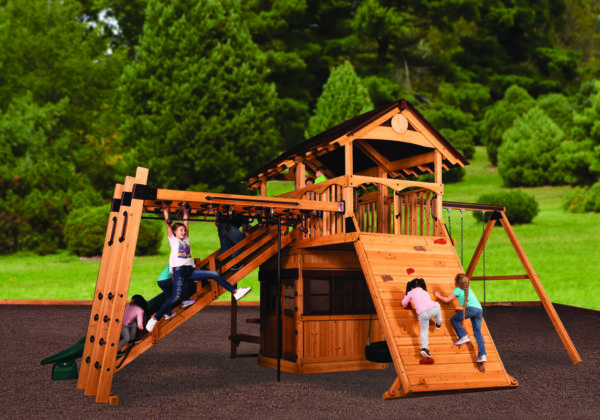 Titan Treehouse XL 9 swingset with children playing on it