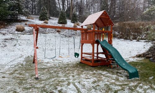 swing set in the snow during winter