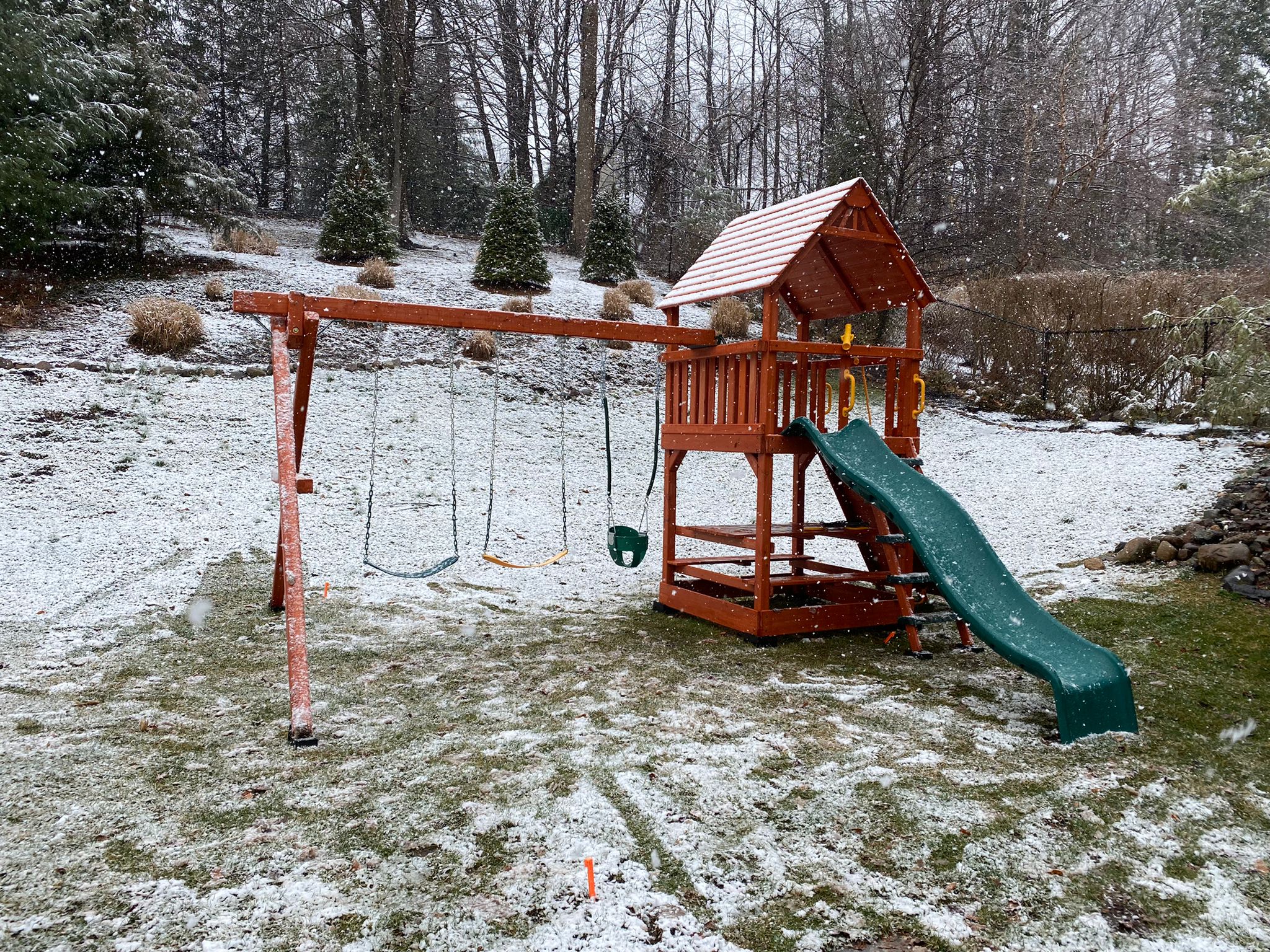 swing set in the snow during winter