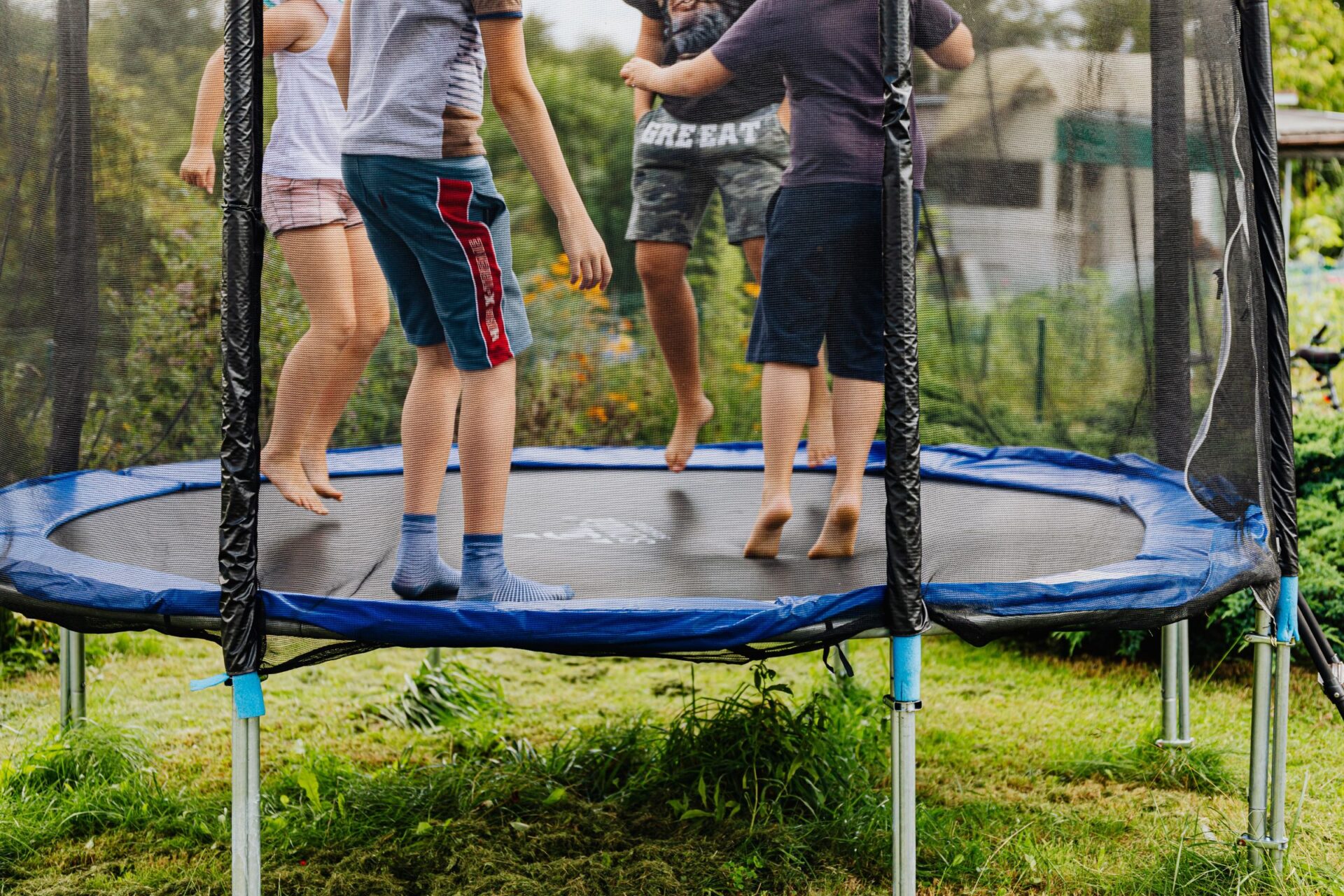 Backyard trampoline with a net